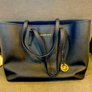 Michael Kors black leather tote bag- 17 inches by 11 inches.